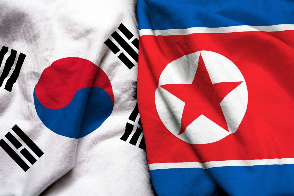 北朝鮮と韓国の 2 つの国旗で、韓国両国を表します。